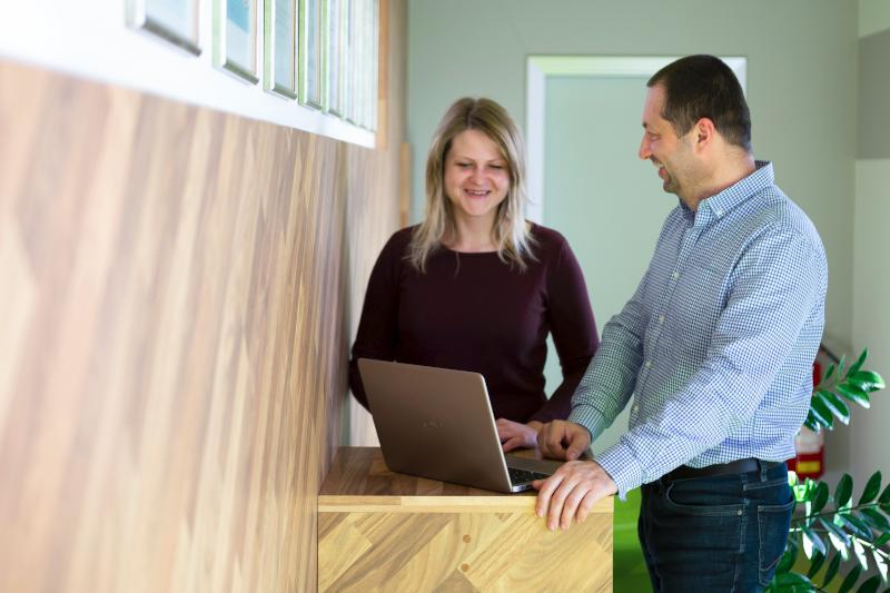 Team collaborating at computers using Whatspot