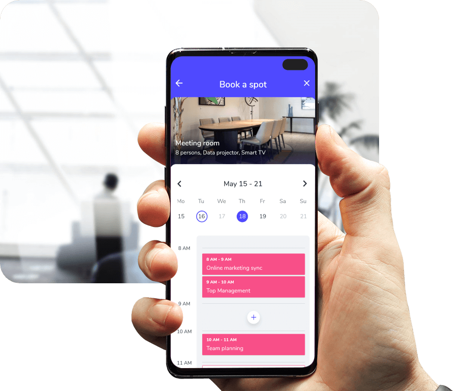 User booking a workplace resource using QR code on mobile phone.
